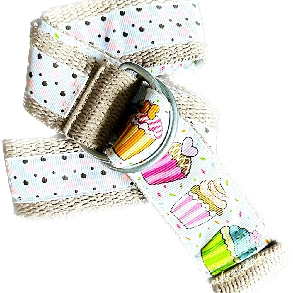 Belt, cupcakes and reverses to hearts on backside Celebrate in style.Adjustable